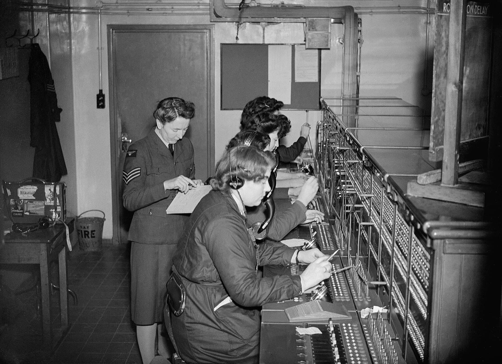 Telephone operators at a switchboard in 1942, routing each call to the right line